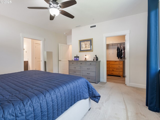 16711 NE 86th St, Vancouver, WA 98682 - bedroom with light carpet, a walk in closet, ceiling fan, ensuite bath, and a closet