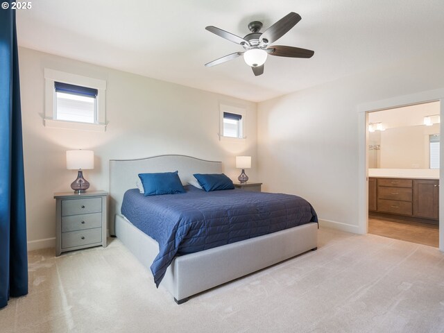 16711 NE 86th St, Vancouver, WA 98682 - bedroom featuring light colored carpet, connected bathroom, and a ceiling fan