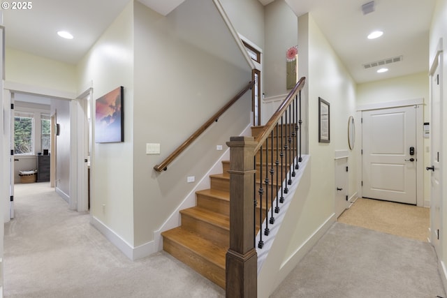 stairs featuring visible vents, recessed lighting, baseboards, and carpet floors