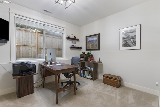 office area featuring visible vents, baseboards, and carpet