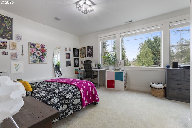 bedroom with visible vents and carpet floors