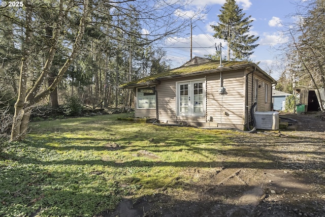 exterior space with french doors and central air condition unit