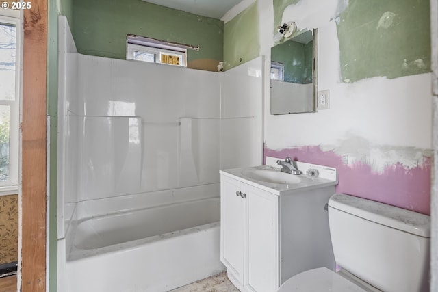 bathroom with  shower combination, vanity, and toilet