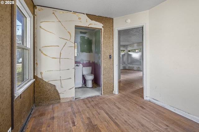 empty room with wood finished floors