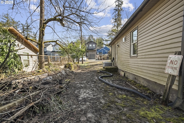 view of yard with a residential view and fence