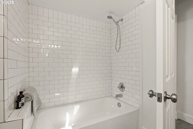 full bath featuring baseboards and bathtub / shower combination