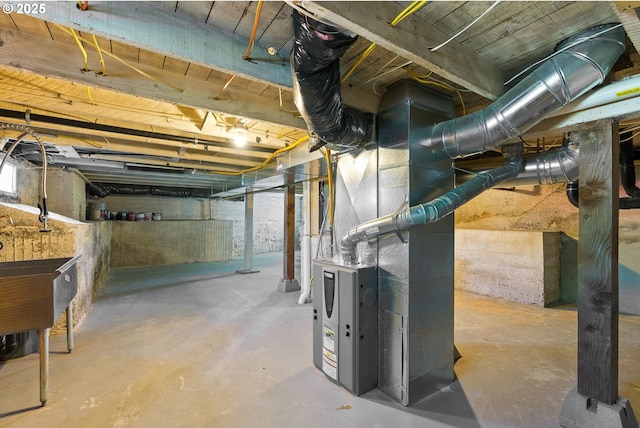 unfinished below grade area featuring heating unit