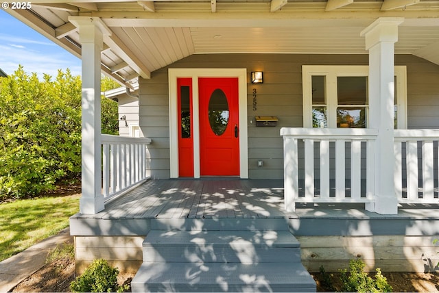 view of exterior entry featuring a porch