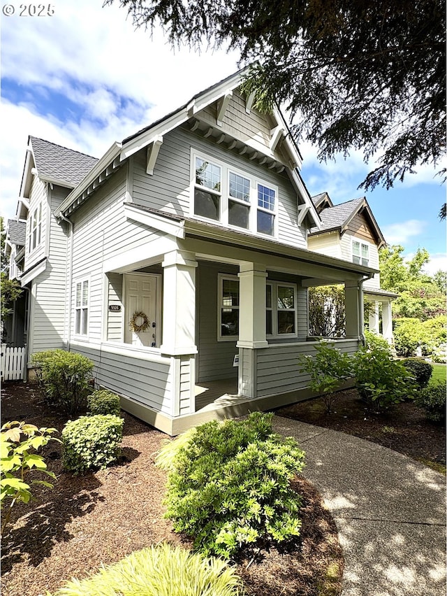 9926 NW Justus Ln Unit 27, Portland, OR 97229 - view of front facade with a porch and roof with shingles