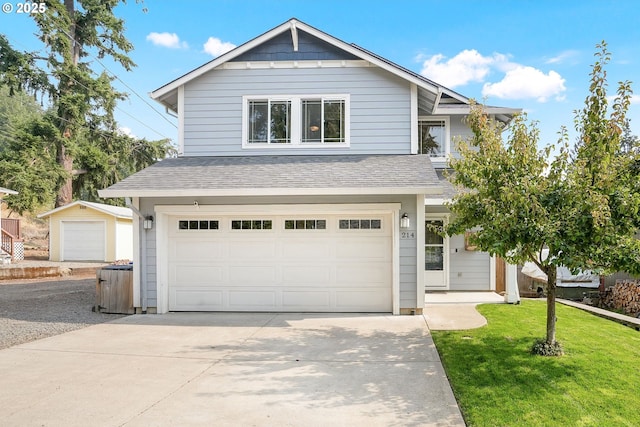 view of front facade with a garage and a front lawn