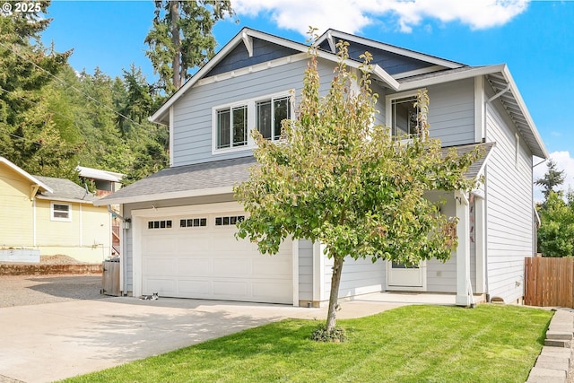 view of front facade featuring a garage and a front lawn