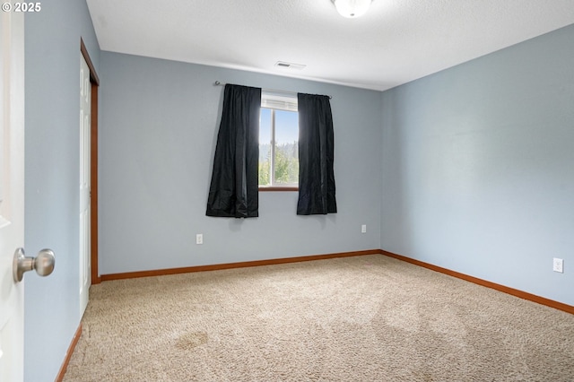 spare room with carpet flooring