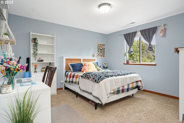 bedroom featuring light carpet