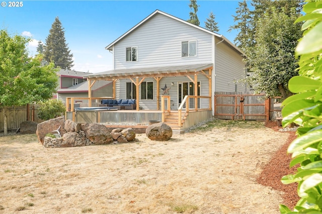 back of property featuring a wooden deck