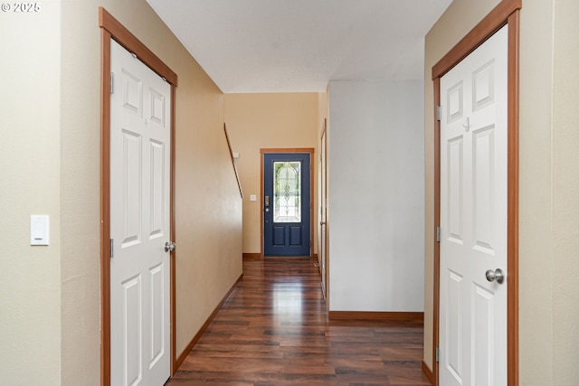 hallway with dark hardwood / wood-style floors