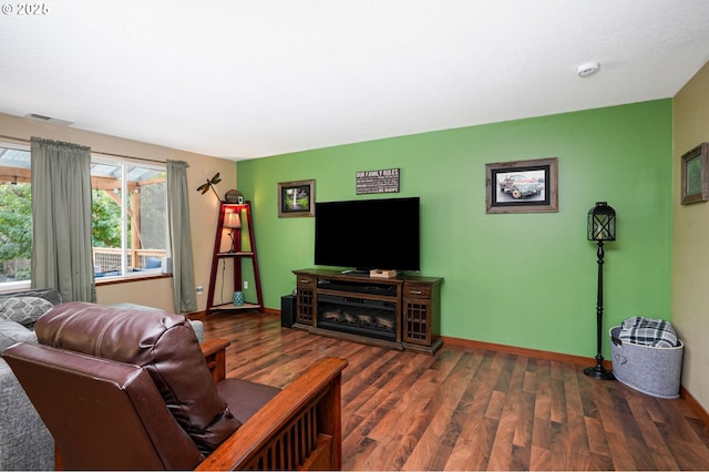 living room with dark hardwood / wood-style flooring