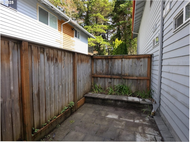 370 4th Pl, Manzanita, OR 97130 - fenced backyard featuring a patio