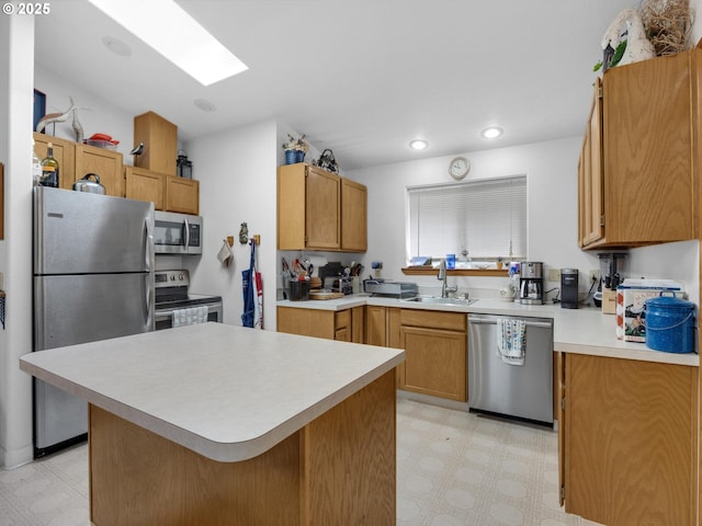 370 4th Pl, Manzanita, OR 97130 - kitchen with appliances with stainless steel finishes, light flooring, a sink, a skylight, and recessed lighting