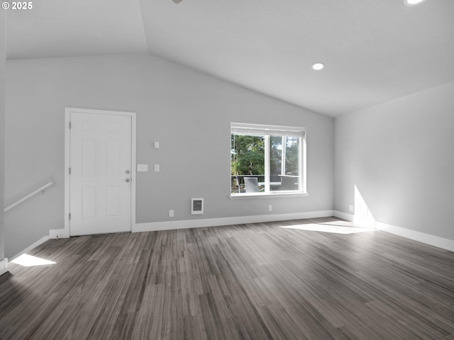 370 4th Pl, Manzanita, OR 97130 - unfurnished living room featuring vaulted ceiling, wood finished floors, baseboards, and recessed lighting