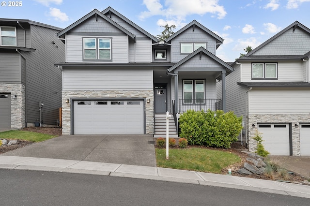 14061 SE Piper Cub Way, Milwaukie, OR 97267 - craftsman-style home featuring stone siding, a garage, and concrete driveway