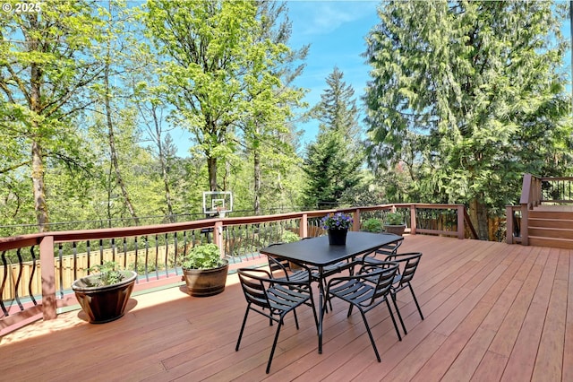 wooden terrace with outdoor dining area