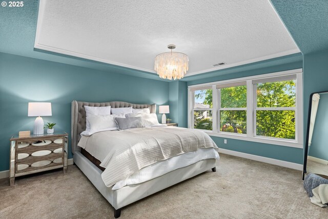 18287 SW Florendo Ln, Beaverton, OR 97007 - bedroom featuring a textured ceiling, a chandelier, and carpet flooring