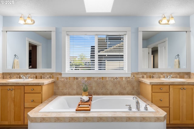 18287 SW Florendo Ln, Beaverton, OR 97007 - full bath featuring two vanities, a garden tub, and a textured ceiling