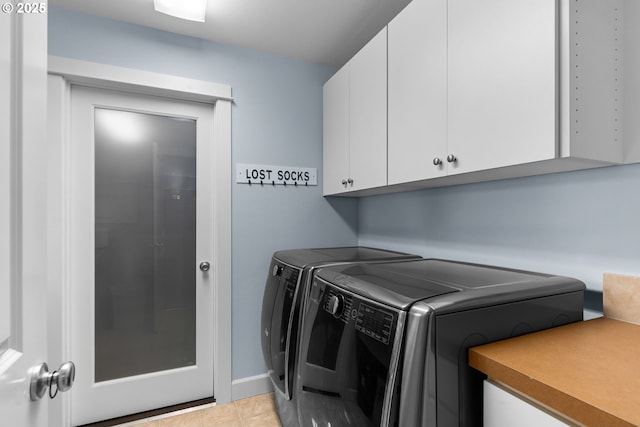 18287 SW Florendo Ln, Beaverton, OR 97007 - laundry area featuring cabinet space, washing machine and dryer, and light tile patterned floors
