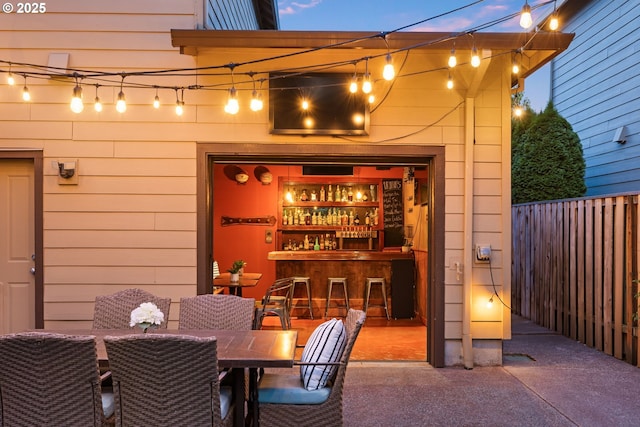 18287 SW Florendo Ln, Beaverton, OR 97007 - carpeted dining space with wood walls and a dry bar