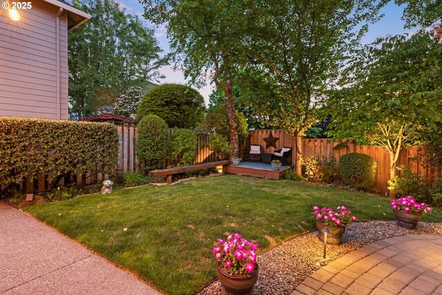 18287 SW Florendo Ln, Beaverton, OR 97007 - yard at dusk featuring a fenced backyard and a patio area
