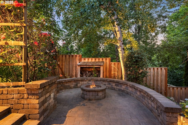 18287 SW Florendo Ln, Beaverton, OR 97007 - fenced backyard featuring a patio area and an outdoor fire pit