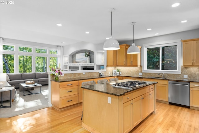 18287 SW Florendo Ln, Beaverton, OR 97007 - kitchen featuring appliances with stainless steel finishes, healthy amount of natural light, light wood-style flooring, and recessed lighting
