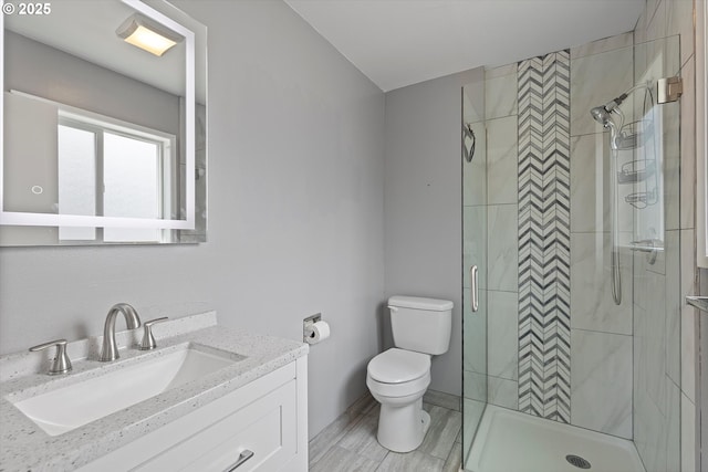 721 NW 76th St, Vancouver, WA 98665 - bathroom featuring toilet, vanity, and a shower stall