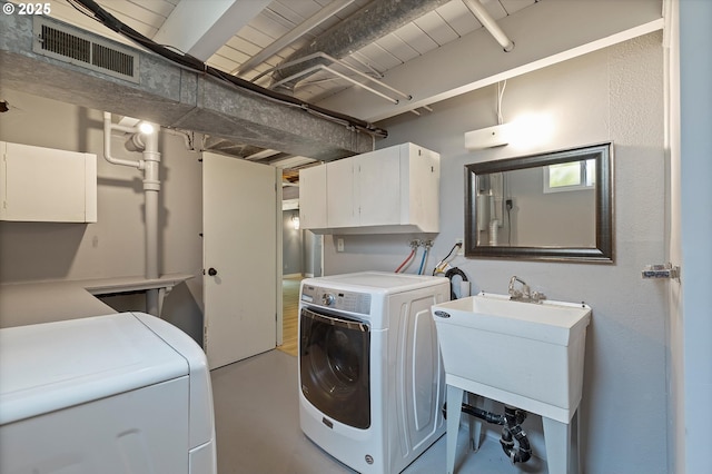 721 NW 76th St, Vancouver, WA 98665 - washroom featuring cabinet space and washing machine and clothes dryer