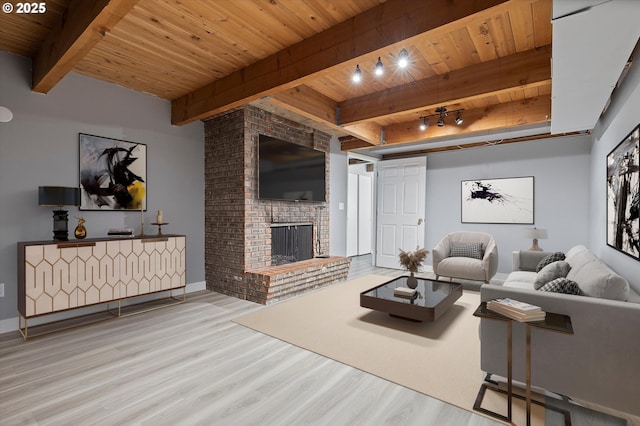 721 NW 76th St, Vancouver, WA 98665 - living area featuring a wood ceiling with exposed beams, wood finished floors, and a brick fireplace