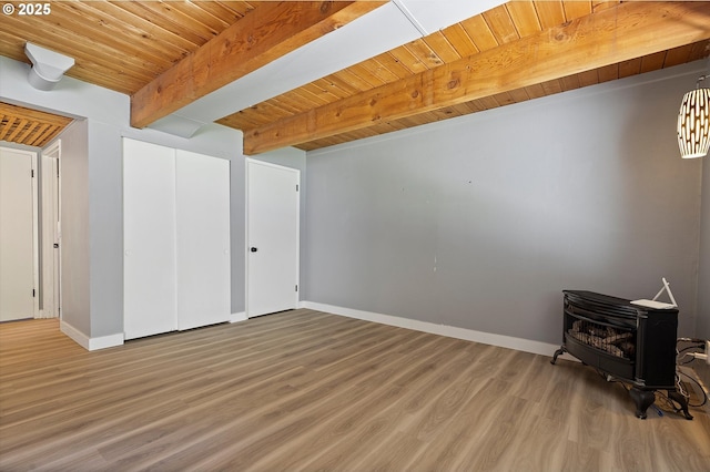 721 NW 76th St, Vancouver, WA 98665 - interior space with a wood stove, wood finished floors, baseboards, and wooden ceiling