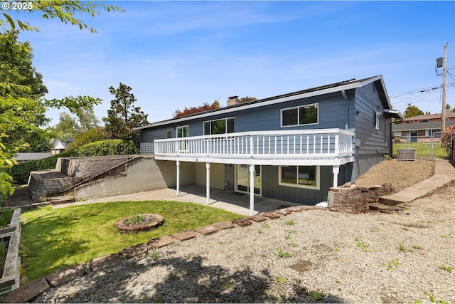 721 NW 76th St, Vancouver, WA 98665 - rear view of property with a patio area, a wooden deck, a lawn, central AC, and a chimney