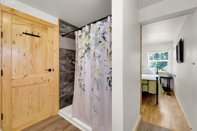 35478 Brabham Rd, Pleasant Hill, OR 97455 - full bathroom with wood finished floors, tiled shower, and baseboards