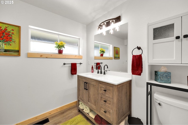 35478 Brabham Rd, Pleasant Hill, OR 97455 - bathroom with toilet, vanity, wood finished floors, and baseboards