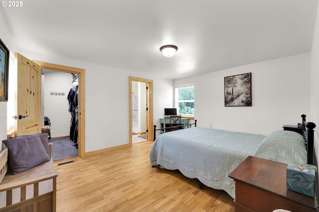 35478 Brabham Rd, Pleasant Hill, OR 97455 - bedroom featuring light wood-style flooring, a closet, a spacious closet, and ensuite bath