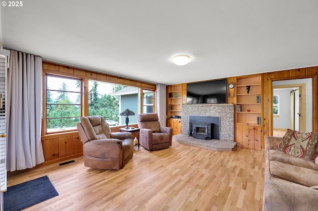 35478 Brabham Rd, Pleasant Hill, OR 97455 - living room featuring light wood-style flooring, wood walls, and built in shelves