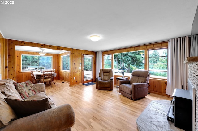 35478 Brabham Rd, Pleasant Hill, OR 97455 - living area with plenty of natural light, light wood-style flooring, and wooden walls