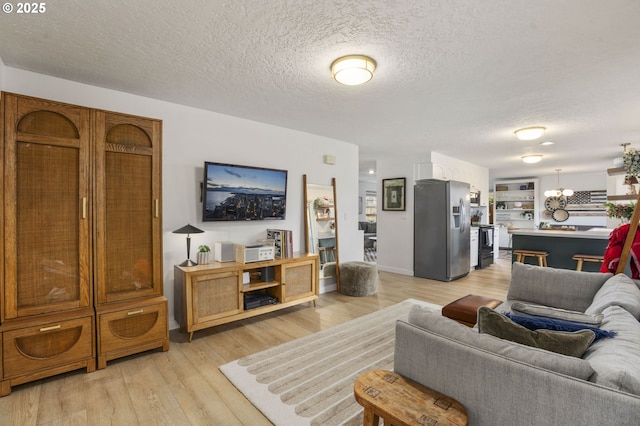 1001 S Grant St, Canby, OR 97013 - living room with a textured ceiling and light wood-type flooring