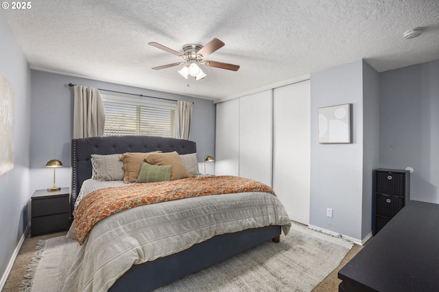 1001 S Grant St, Canby, OR 97013 - bedroom with carpet floors, a closet, a textured ceiling, and ceiling fan