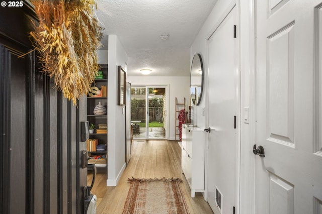 1001 S Grant St, Canby, OR 97013 - hallway with a textured ceiling and light wood-type flooring