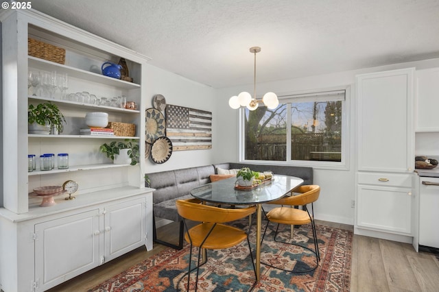 1001 S Grant St, Canby, OR 97013 - dining space with wood finished floors, breakfast area, and a textured ceiling