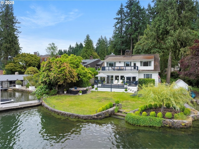 1667 Lake Front Rd, Lake Oswego, OR 97034 - back of property featuring a balcony, a yard, a chimney, a water view, and an outdoor living space