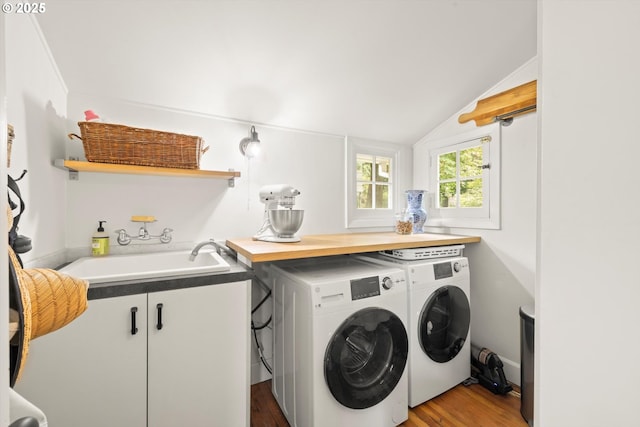 1667 Lake Front Rd, Lake Oswego, OR 97034 - laundry room featuring independent washer and dryer, wood finished floors, and cabinet space