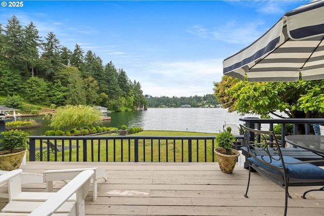 1667 Lake Front Rd, Lake Oswego, OR 97034 - wooden deck featuring a water view, a lawn, and a wooded view