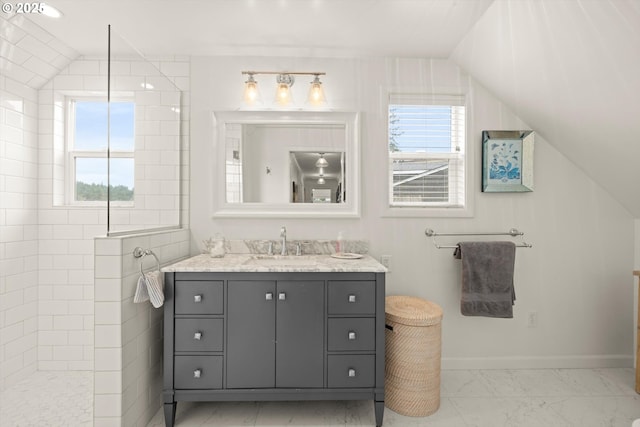 1667 Lake Front Rd, Lake Oswego, OR 97034 - full bath with vanity, healthy amount of natural light, walk in shower, marble look tiles, and vaulted ceiling
